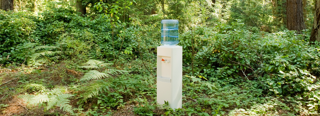 A water cooler in the middle of a forest